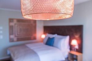 Postel nebo postele na pokoji v ubytování Hotel My Way Zürich Wallisellen