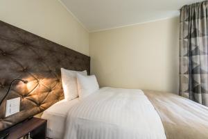 Postel nebo postele na pokoji v ubytování Hotel My Way Zürich Wallisellen