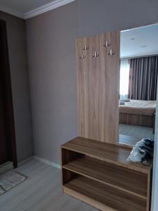 a room with a mirror and a wooden cabinet at White Peaks in Mestia