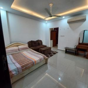 Ένα ή περισσότερα κρεβάτια σε δωμάτιο στο Mabillah muscat