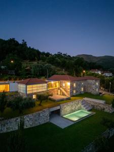 an aerial view of a home at night at Capim Limão Country House in Ponte de Lima