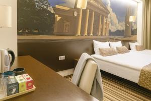 Ένα ή περισσότερα κρεβάτια σε δωμάτιο στο Vilnius City Room