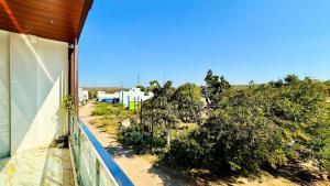 a view from the balcony of a house with trees at Hotel Pujari Palace in Godarpura