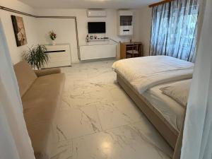 En eller flere senge i et værelse på Apartman DIJANA BANJA LUKA