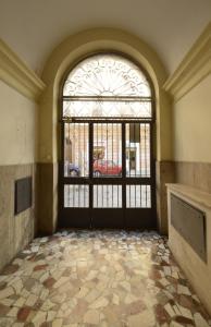 an empty room with a door with a large window at Via Montebello in Rome