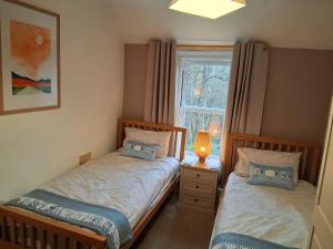 En eller flere senge i et værelse på Tan-Y-Garth Cottage Snowdonia