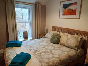 En eller flere senge i et værelse på Tan-Y-Garth Cottage Snowdonia