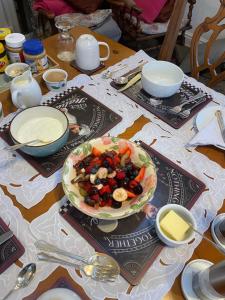 a table with a bowl of food on top of it at Twyford Homestay B&B in Llandrindod Wells +4 photos