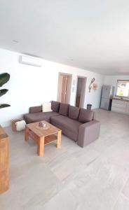 a living room with a couch and a coffee table at Casa Calma in Las Breñas