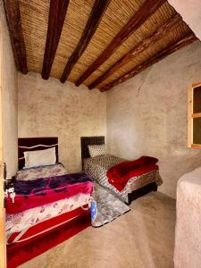 a bedroom with two beds in a room at La Belle Etoile in Ouazzane +30 photos