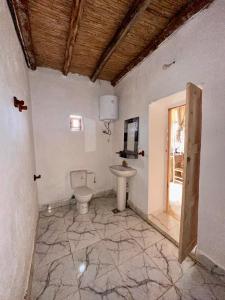 a bathroom with a toilet and a sink at La Belle Etoile in Ouazzane