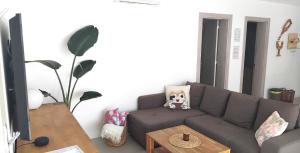 a living room with a couch and a table at Casa Calma in Las Breñas