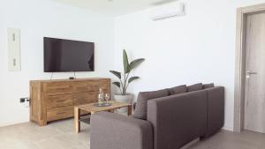 a living room with a couch and a tv at Casa Calma in Las Breñas +43 photos