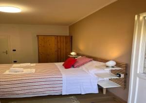 Una cama o camas en una habitación de Casa ai Dossi