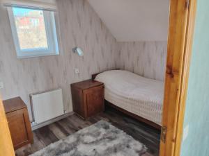 Ένα ή περισσότερα κρεβάτια σε δωμάτιο στο AGA Frame