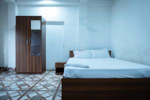 Postel nebo postele na pokoji v ubytování Kaziranga Homestay