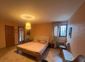 a bedroom with a bed and a window at Gîte au Ventoux in Villes-sur-Auzon +34 photos