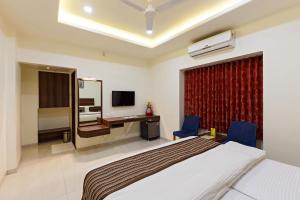 Giường trong phòng chung tại Hotel Rajpurush +2 ảnh