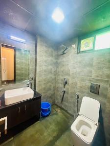 Et badeværelse på Samriddhi Studio Apartment