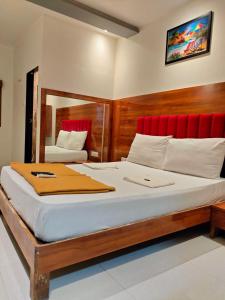 Una cama o camas en una habitación de Hotel Anuha