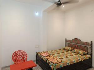 Postel nebo postele na pokoji v ubytování Shri Vyankatesh Bhakt Niwas