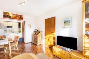 a living room with a large flat screen tv at Ferienoase Balve in Balve
