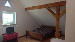 Postel nebo postele na pokoji v ubytování Forsycja