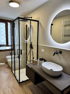 a bathroom with a sink and a mirror at Cima Bianca Suite in Passo del Tonale +42 photos