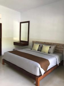 Postel nebo postele na pokoji v ubytování Maha di Nusa Lembongan + 48 fotografií