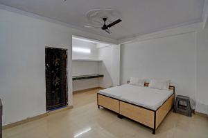 Postel nebo postele na pokoji v ubytování Hotel O Tulip Gold