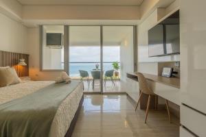 Ένα ή περισσότερα κρεβάτια σε δωμάτιο στο Cartagena Beach Resort