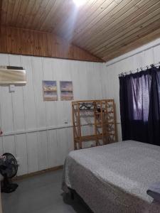 Ένα ή περισσότερα κρεβάτια σε δωμάτιο στο Aconchego no Campeche