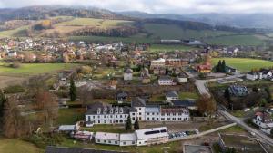 een luchtzicht op een stad in de heuvels bij Resort Červený dvůr - apartmány a privátní wellness in Rapotín +120 foto's