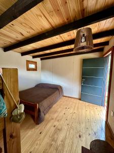 En eller flere senge i et værelse på Camping Aiton Amunak