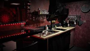 Lounge nebo bar v ubytování Love room Sparadis Laval 53 Studio avec jacuzzi privatif + 12 fotografií