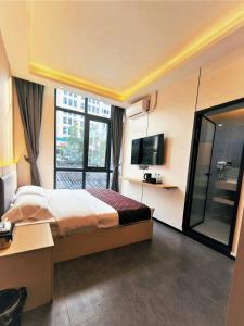 TV a/nebo společenská místnost v ubytování 游子酒店