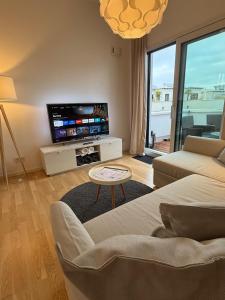 TV/trung tâm giải trí tại Deluxe Penthouse Goldsteinkoje 1 +41 ảnh