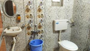 Koupelna v ubytování Tiger Home Stay Resort + 13 fotografií