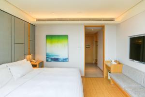 Giường trong phòng chung tại JI Hotel Suzhou South Renmin Road