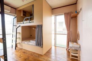 Кровать или кровати в номере みどり荘 midorisou