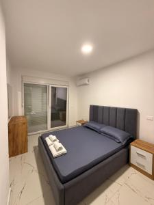 En eller flere senge i et værelse på Kron apartment