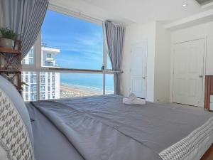 Ένα ή περισσότερα κρεβάτια σε δωμάτιο στο Oasky View Thap Tam Thang - Blue Homestay Vung Tau +61 φωτογραφίες