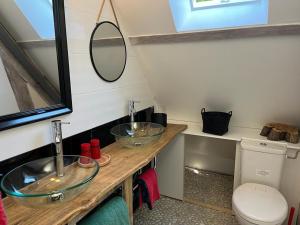 a bathroom with two sinks and a toilet at LE PARC DU VIVIER in Fernestrelay +31 photos