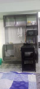 a kitchen with a counter and a table in a room at Royal properties thika jomoko in Thika +15 photos