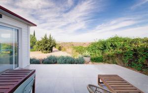 a patio with chairs and a view of the desert at Casa Boletes, with splendid views! in Cartagena