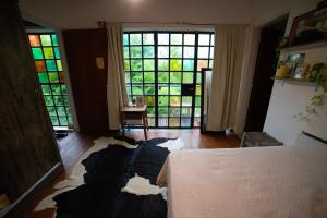 En eller flere senge i et værelse på Habitación doble con balcón y pileta en las sierras Unquillo + 22 billeder