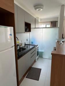 Køkken eller tekøkken på VOG Torres do Sul Litoral Ilhéus