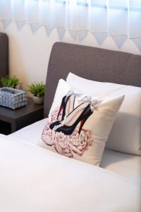 a picture of a shoe on a pillow on a bed at sunshin dream in Osaka