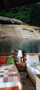 Postel nebo postele na pokoji v ubytování Rancho São Francisco de Assis - 2 suítes