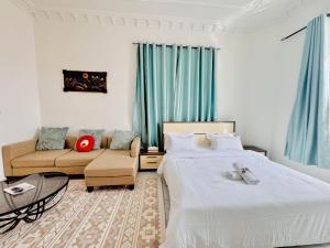 Ένα ή περισσότερα κρεβάτια σε δωμάτιο στο Fully Furnished Studio Near Exibition Center Abu Dhabi